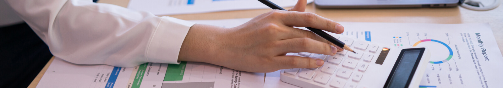 Close up of a person's hands using a calculator